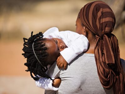 4118503 - african family, mother and child, living  in a very poor village near kalahari desert